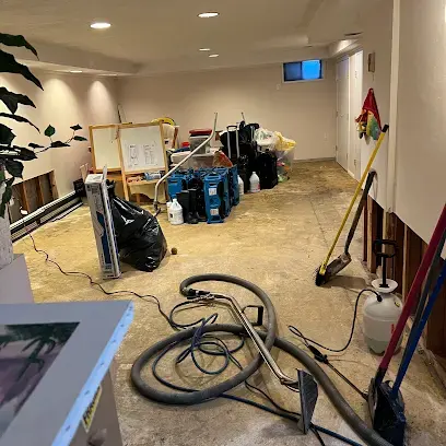 Room stripped to the subfloor with drying equipment in Huntington Station, NY