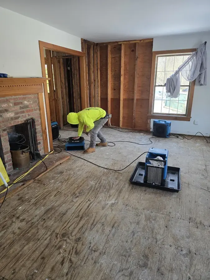 Flooring removed and air movers drying a room in Huntington Station, NY