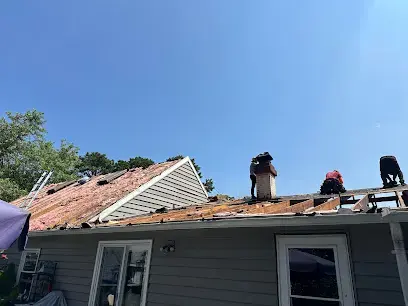 Damaged roof decking opened up after a roof leak in Huntington Station, NY